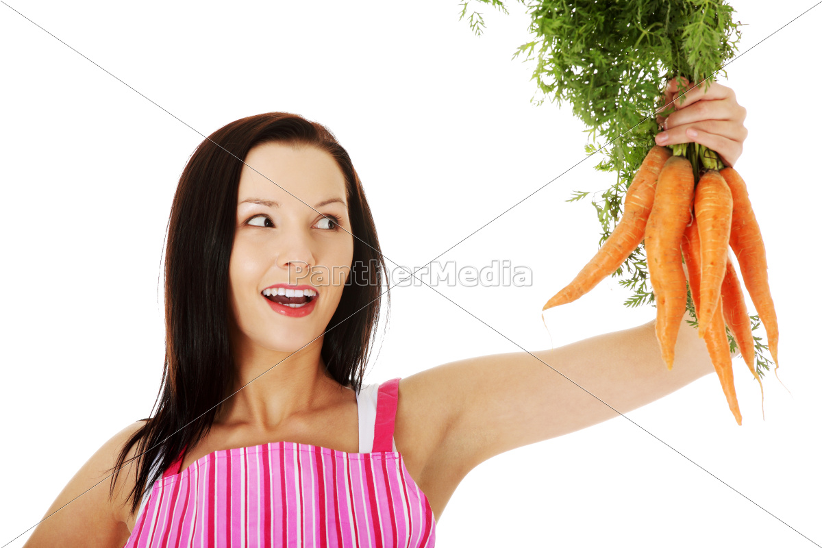 Giovane donna che tiene carote fresche - Stockphoto #9520386